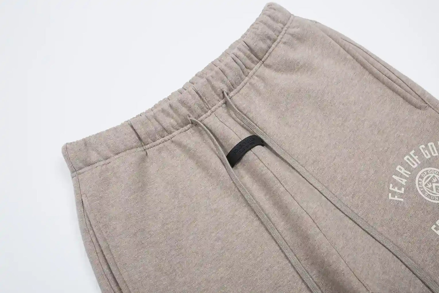 Ribbed ankle cuffs and side pocket detail on sweatpants by Fear of God