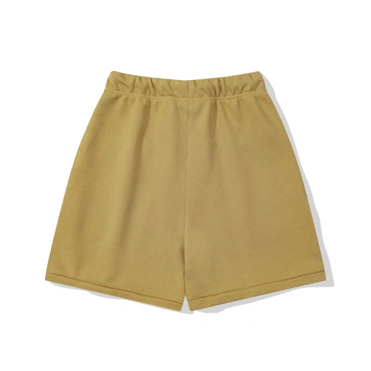 Fear of God Essentials Garden Yellow fleece shorts with tonal logo and relaxed streetwear fit