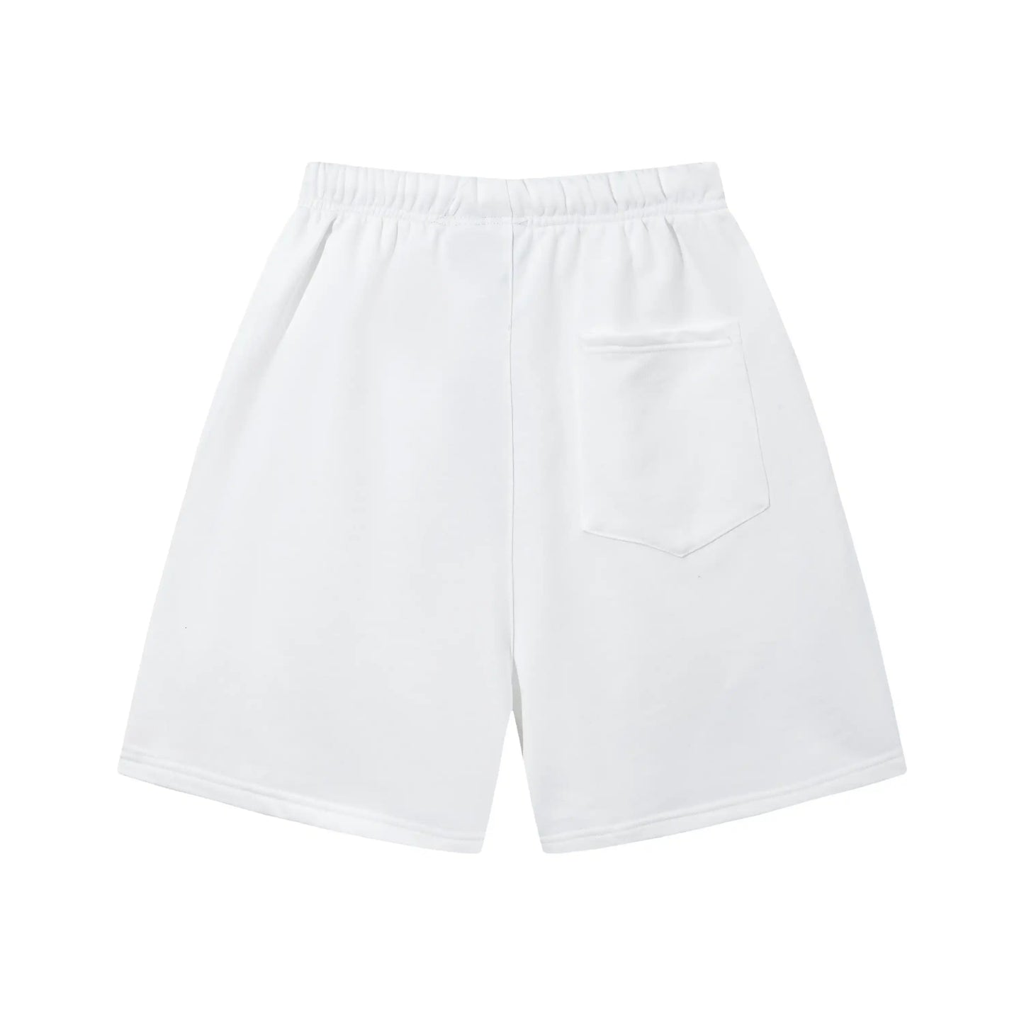 Model wearing Fear of God Essentials Eggshell Beige Shorts, showing relaxed fit and subtle ESSENTIALS logo detail.