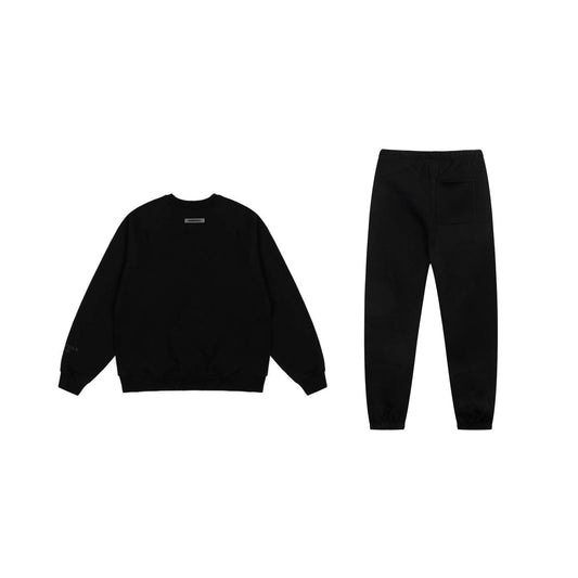 Essentials black core streetwear fleece hoodie with soft interior detail by Fear Of God