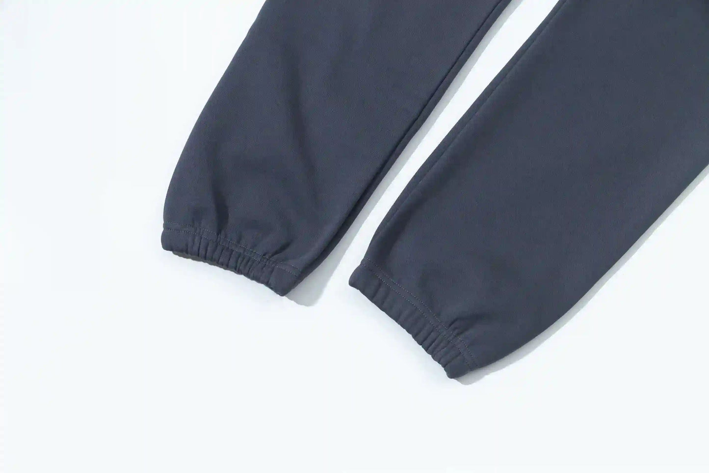 Jogger style blue sweatpants by Fear of God with elastic waistband