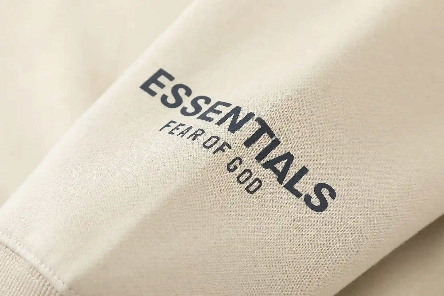 Essentials light cream hoodie mock neckline and stitching detail