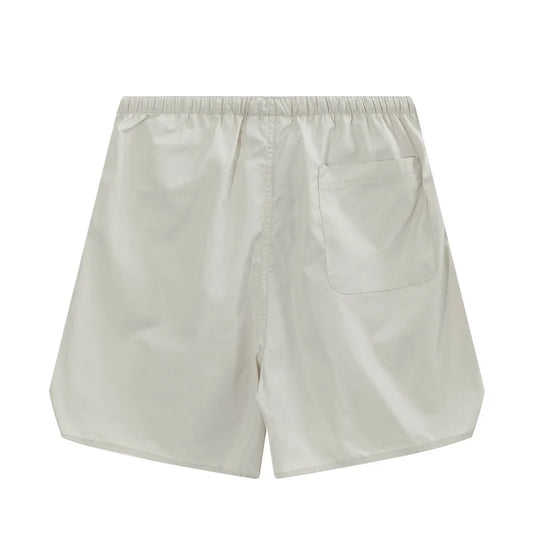 Fear of God Essentials Cloud Dance fleece shorts relaxed fit side view