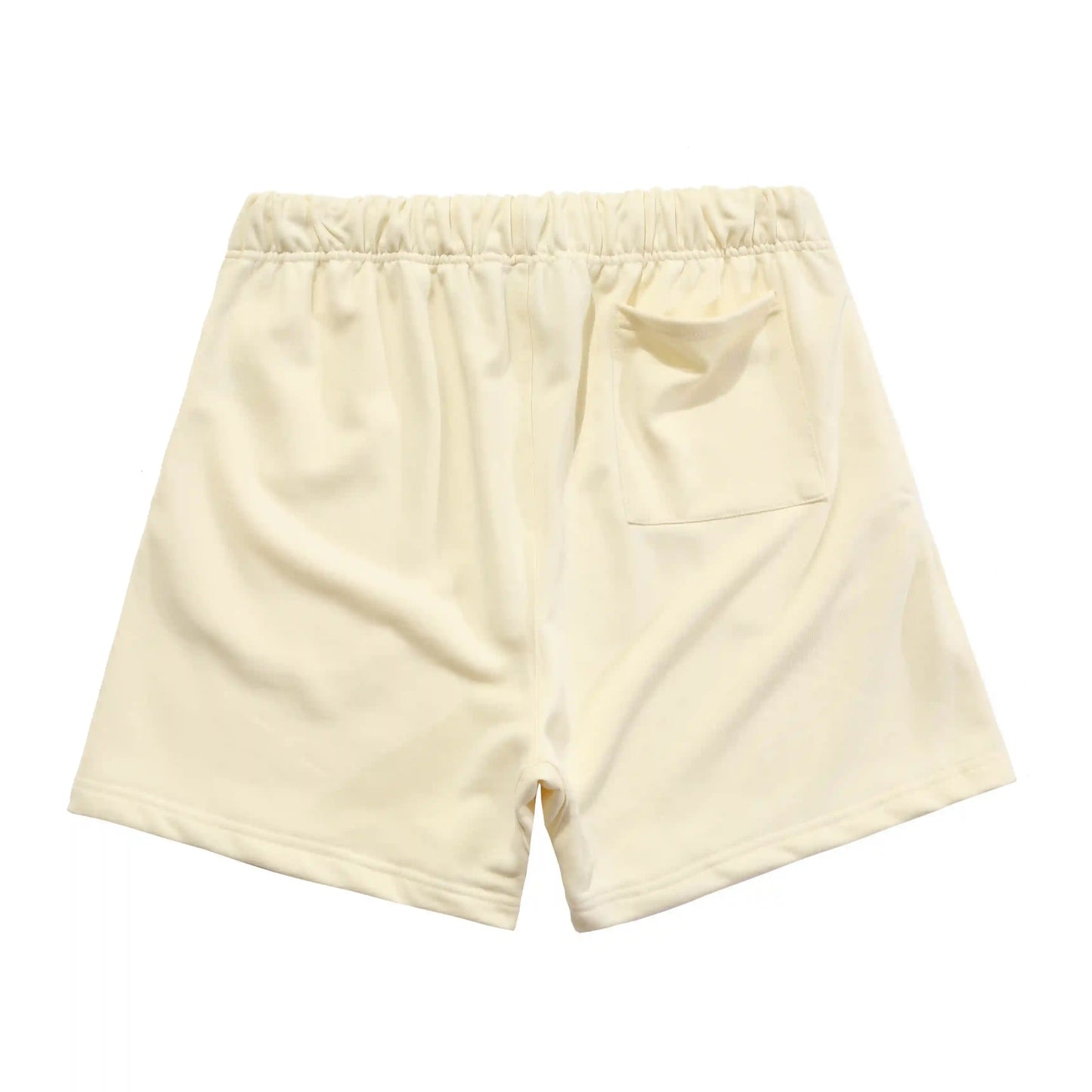 Fear of God Essentials light cream fleece shorts with tonal branding and relaxed fit