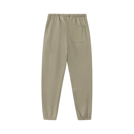 Jogger style heathered grey sweatpants by Fear of God with elastic waistband