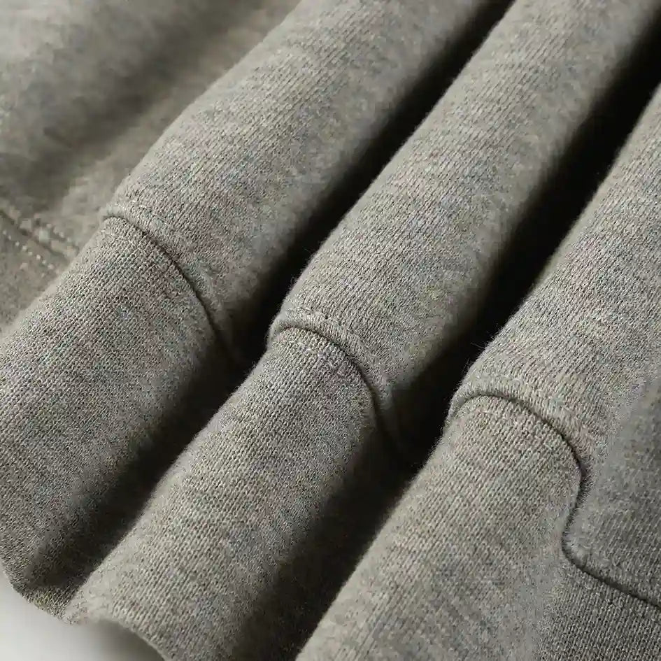 Essentials Light Heather oatmeal zip-up hoodie bottom view – Fear of God
