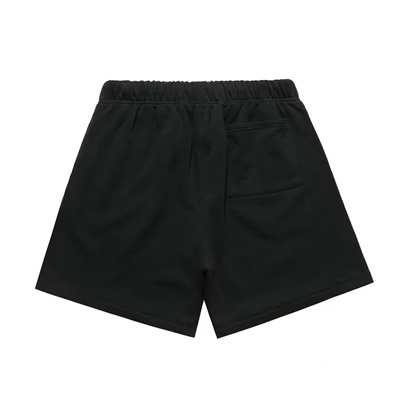 Fear of God Essentials black fleece shorts with tonal logo and relaxed silhouette