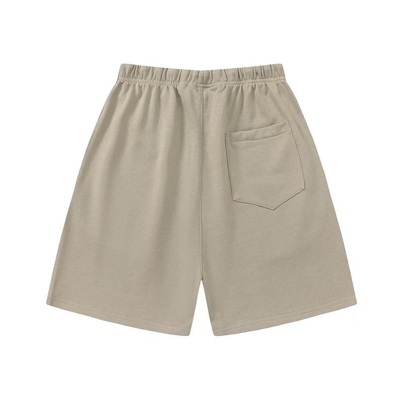 Fear of God Essentials heathered grey fleece shorts with relaxed fit and tonal logo
