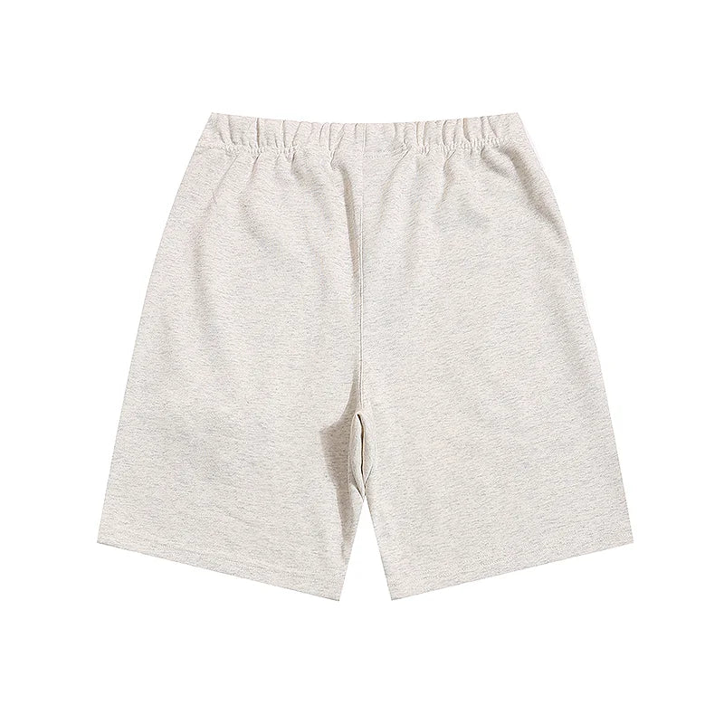 Fear of God Essentials Cloud Dance shorts in light grey fleece with relaxed silhouette