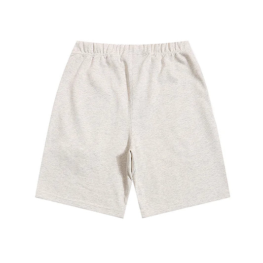Fear of God Essentials Cloud Dance shorts in light grey fleece with relaxed silhouette
