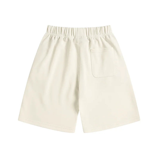 Fear of God Essentials Cloud Dance shorts in soft white fleece with relaxed fit and tonal branding