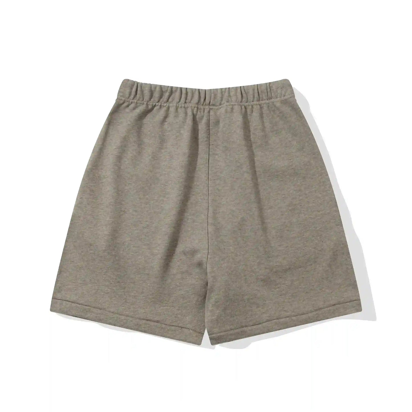 Fear of God Essentials Almond Frost fleece shorts in warm neutral tone with tonal logo and relaxed fit