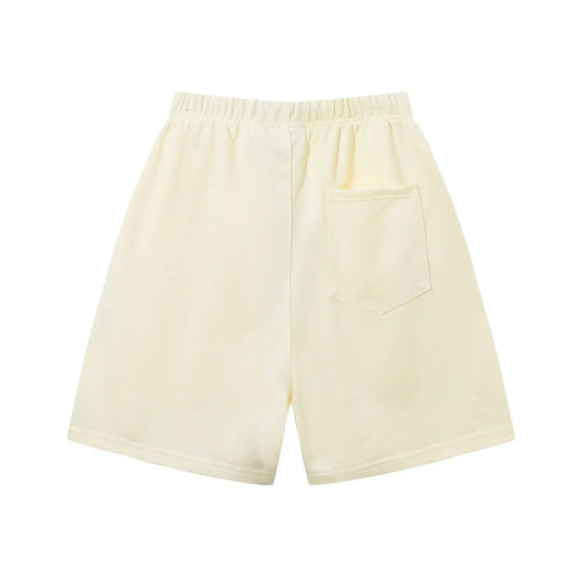 Fear of God Essentials Light Cream fleece shorts relaxed fit side view