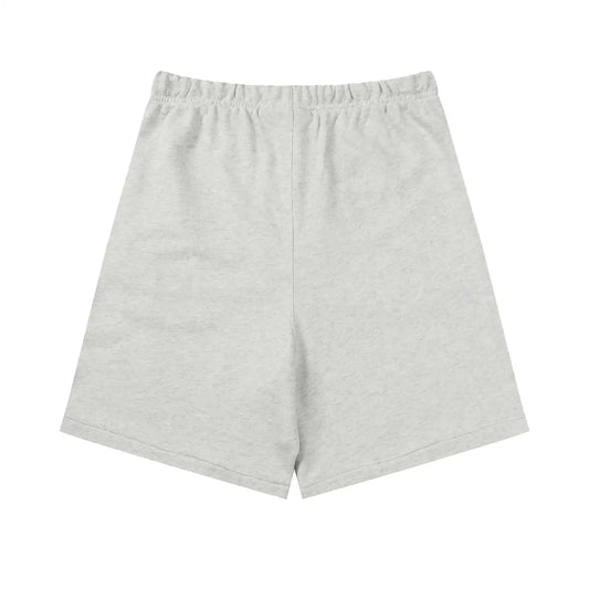 Fear of God Essentials Light Heather Oatmeal shorts in fleece with drawstring waistband and tonal branding