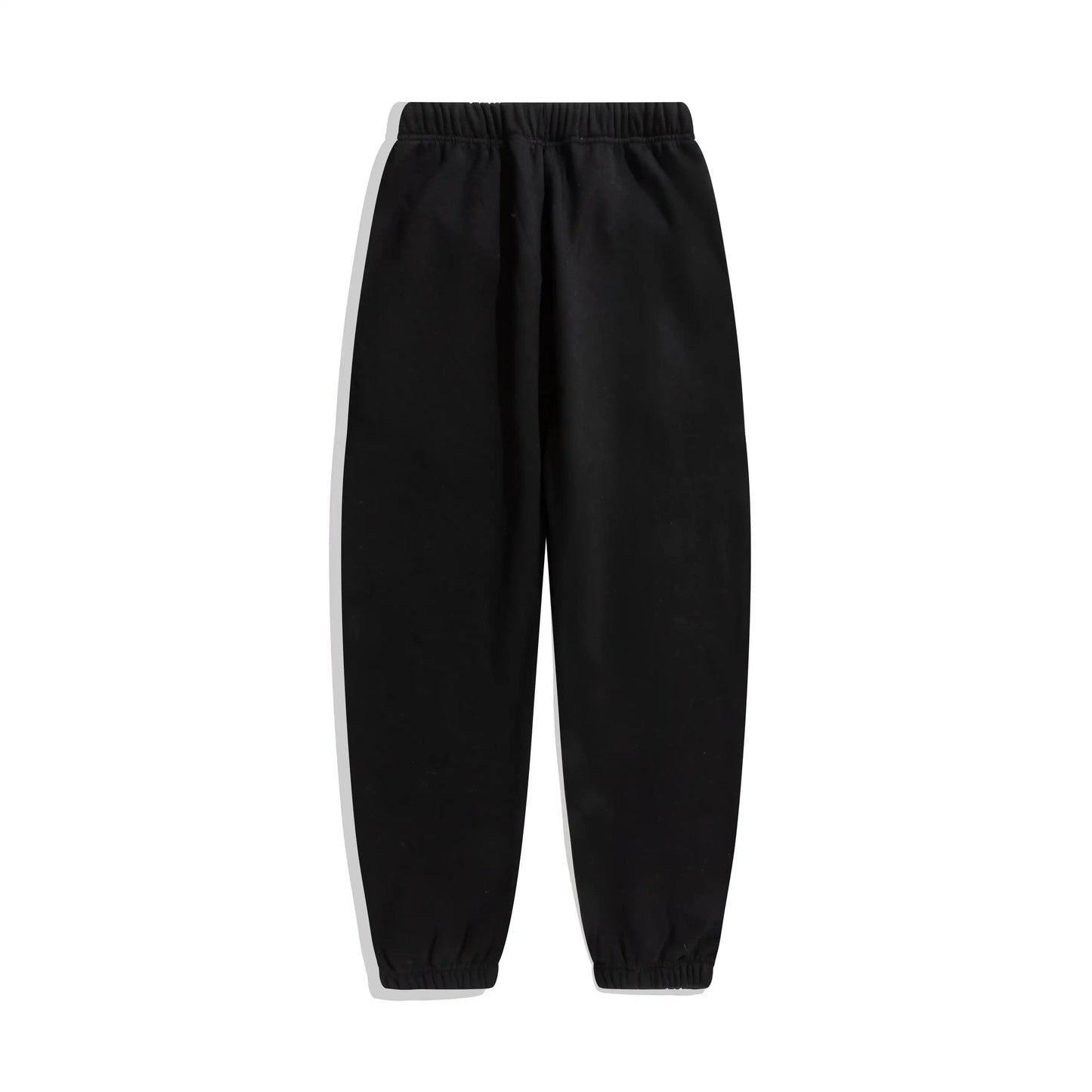 Essentials rubberized label detail on black tracksuit (hood or front label)