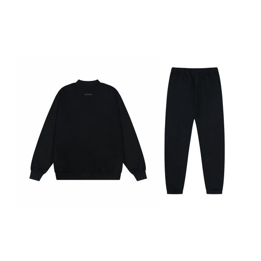 Essentials black classic comfort fleece hoodie with soft interior detail by Fear Of God