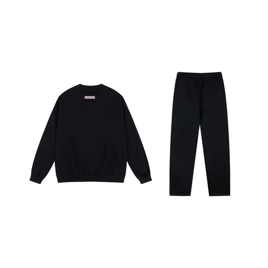 Essentials tracksuit black full set angled view relaxed fit