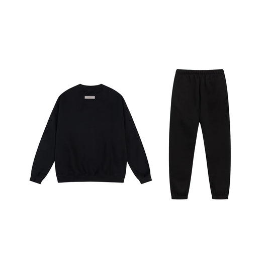 Essentials tracksuit black full set angled view relaxed fit