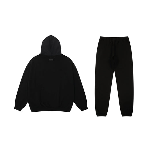Essentials tracksuit black full set angled view relaxed fit