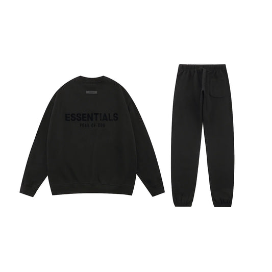 Essentials black fleece joggers with elastic waistband comfort by Fear Of God