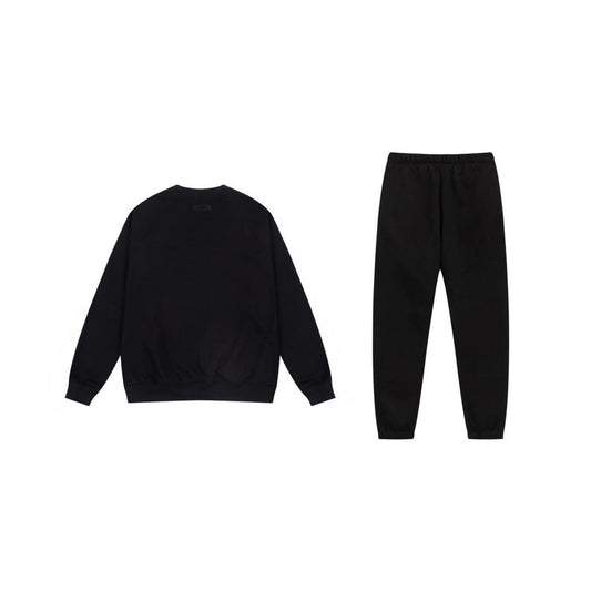 Essentials black luxe fleece hoodie with soft interior detail by Fear Of God