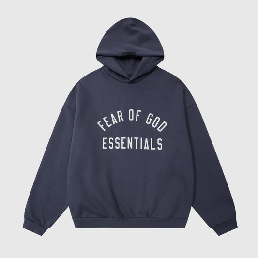 Fear of God Essentials blue hoodie front view with rubberized black bar branding