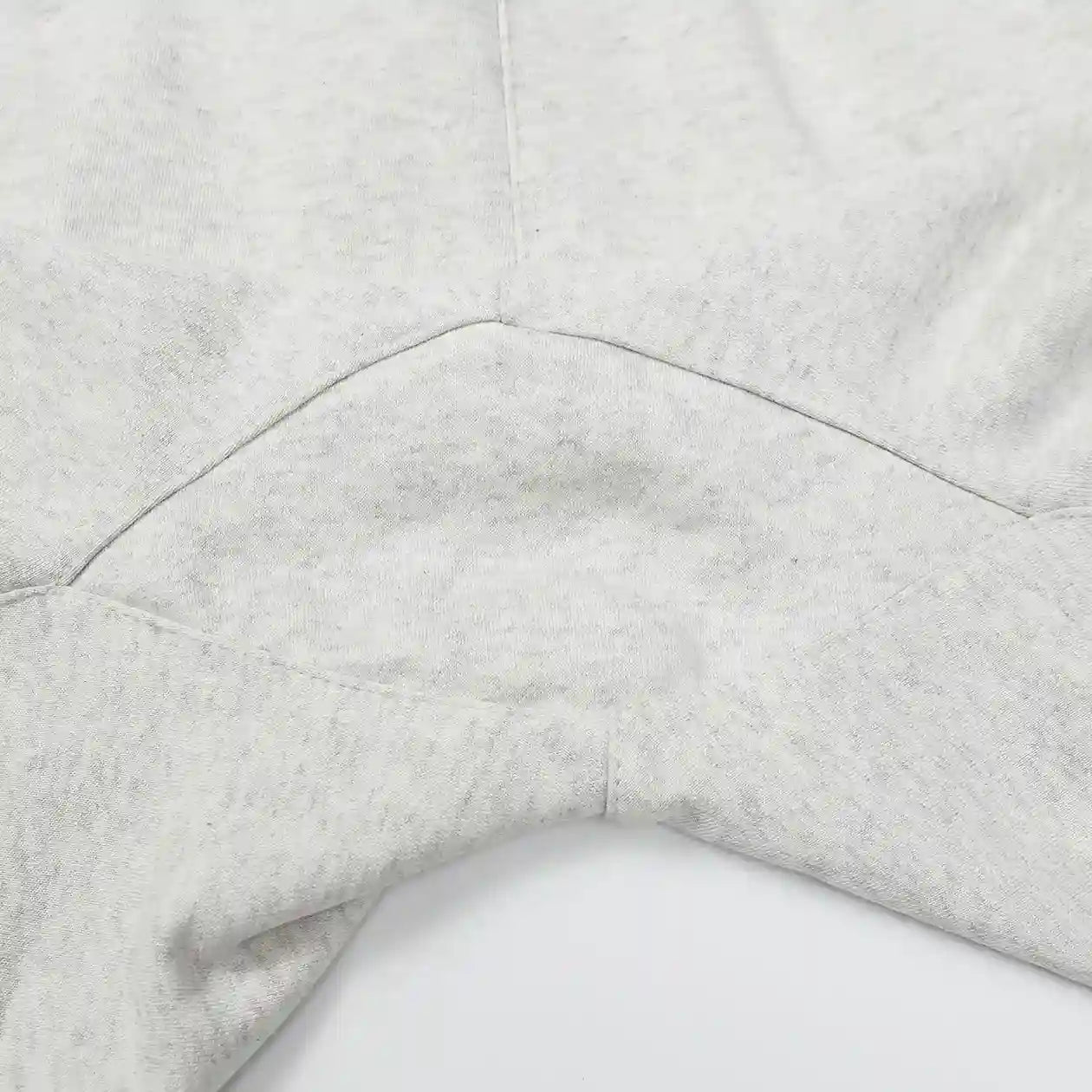 Fear of God Essentials light heather oatmeal fleece shorts with tonal branding and relaxed silhouette