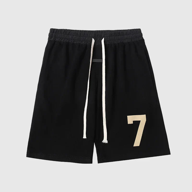Fear of God Essentials black fleece shorts with tonal branding and modern relaxed fit