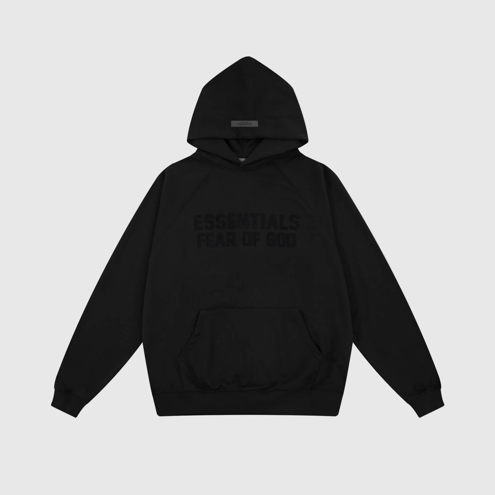 Fear of God Essentials black hoodie front view with rubberized front bar branding