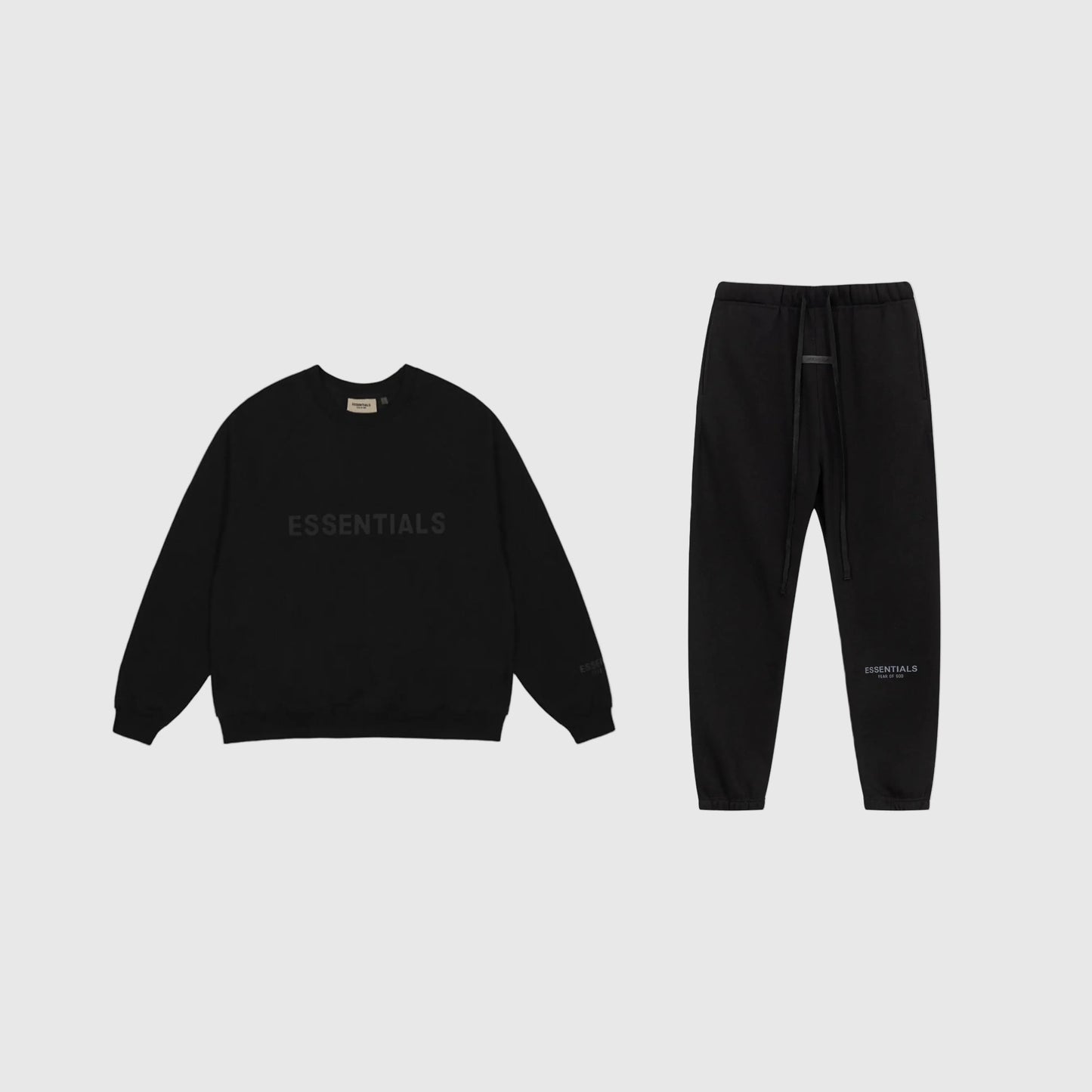 Essentials black core streetwear fleece tracksuit set with relaxed fit by Fear Of God

