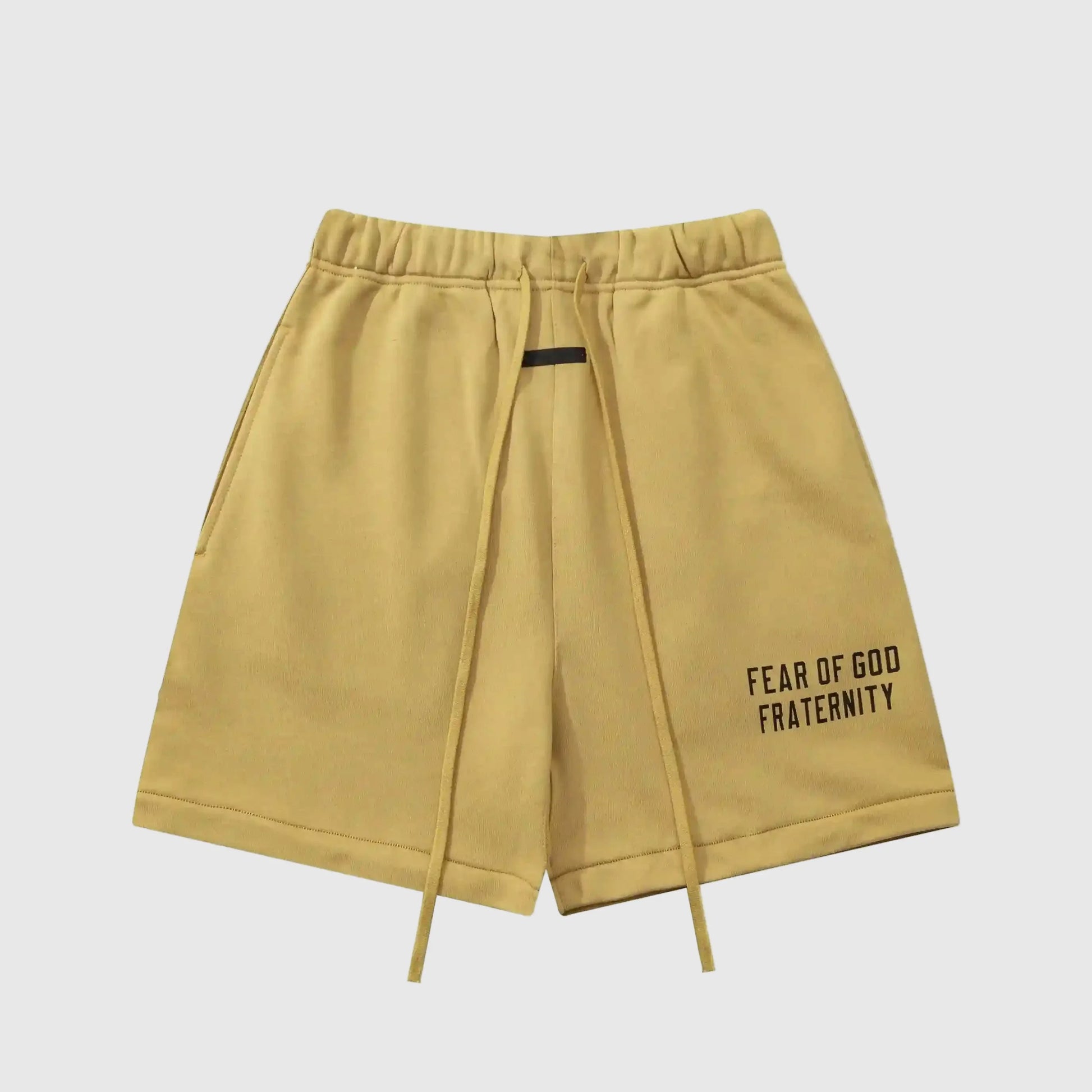 Fear of God Essentials Garden Yellow fleece shorts with tonal branding and relaxed streetwear fit