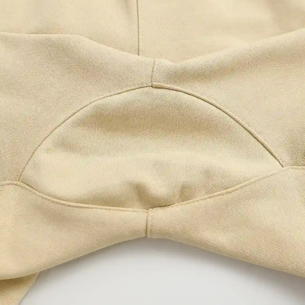 Fear of God Essentials Calm Shell Shorts in beige fleece with drawstring waistband