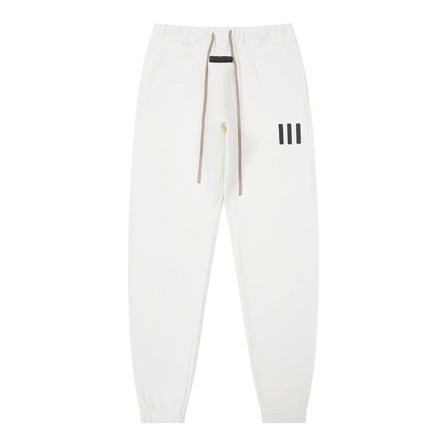Eggshell Essentials joggers soft-touch rubberized logo on leg close-up