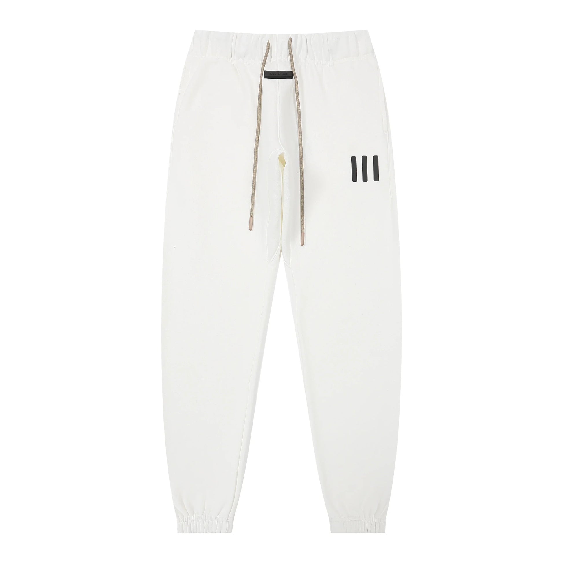 Eggshell Essentials joggers soft-touch rubberized logo on leg close-up