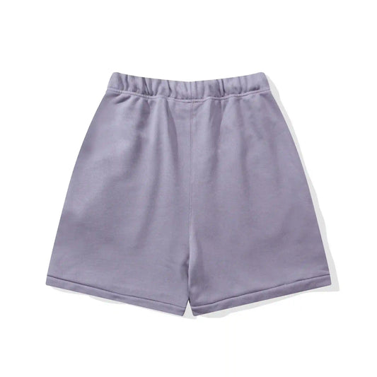 Fear of God Essentials pastel purple fleece shorts with relaxed fit and tonal branding