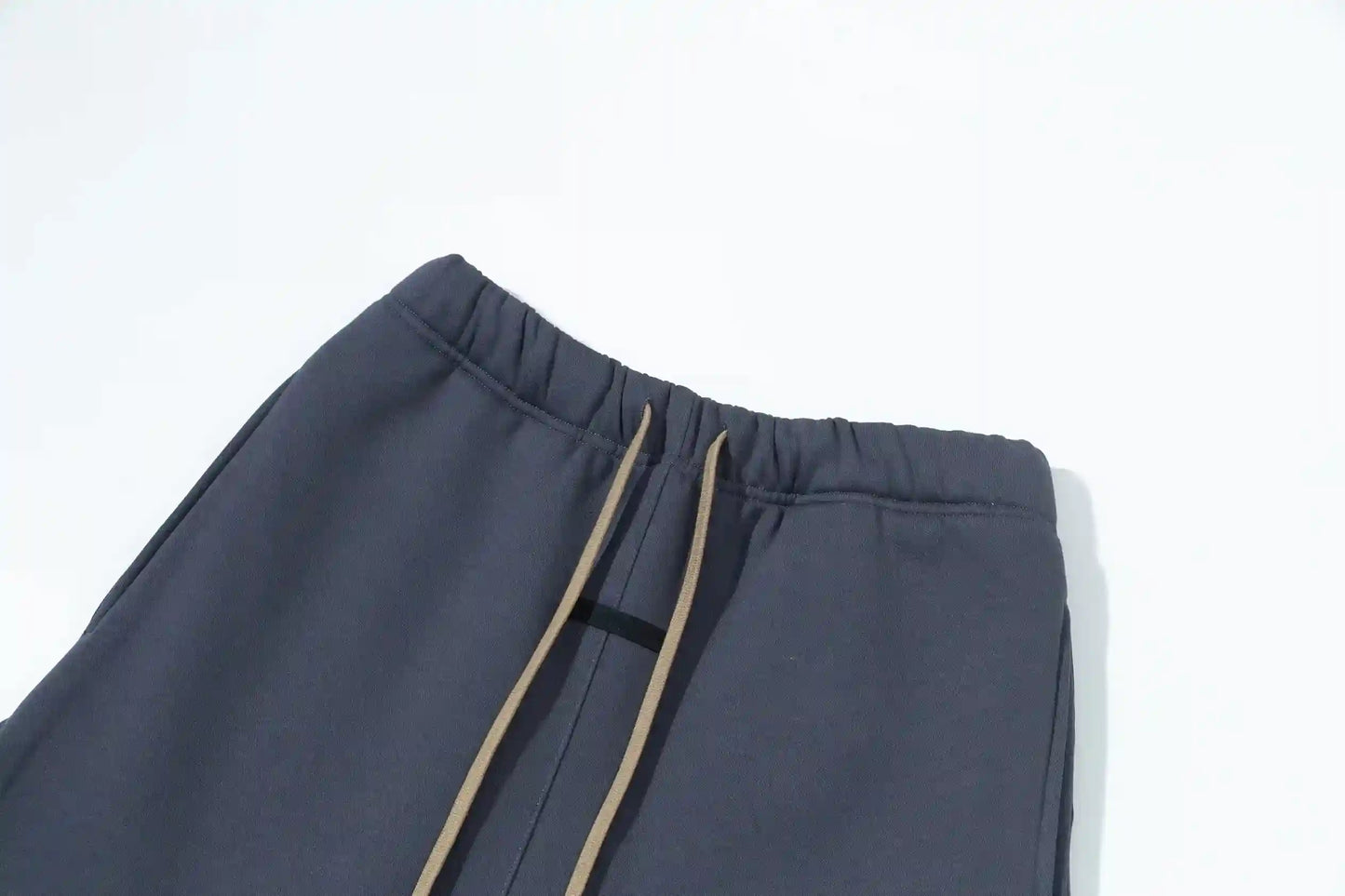 Premium fleece fabric detail on blue sweatpants by Fear of God