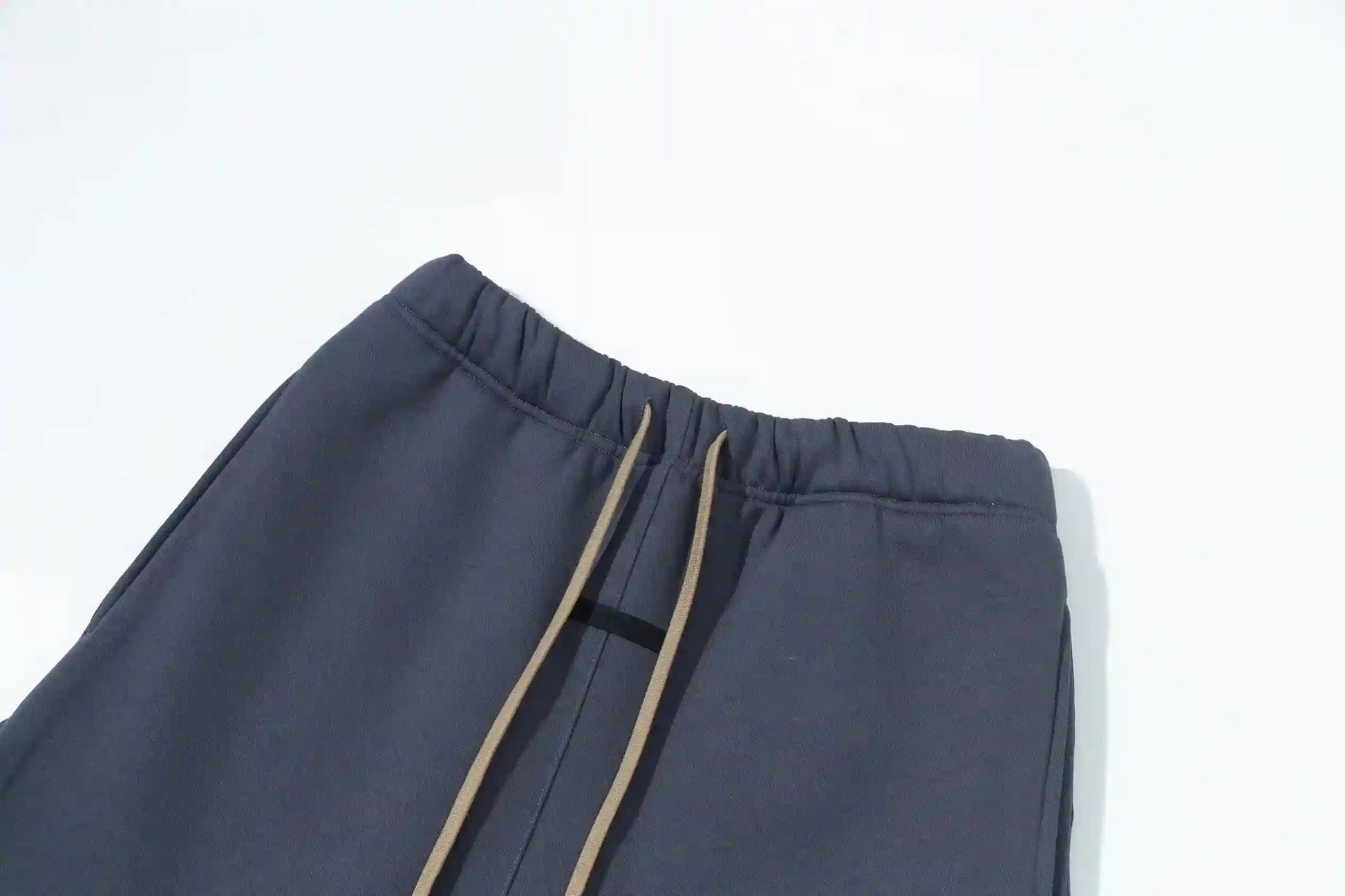 Premium fleece fabric detail on blue sweatpants by Fear of God