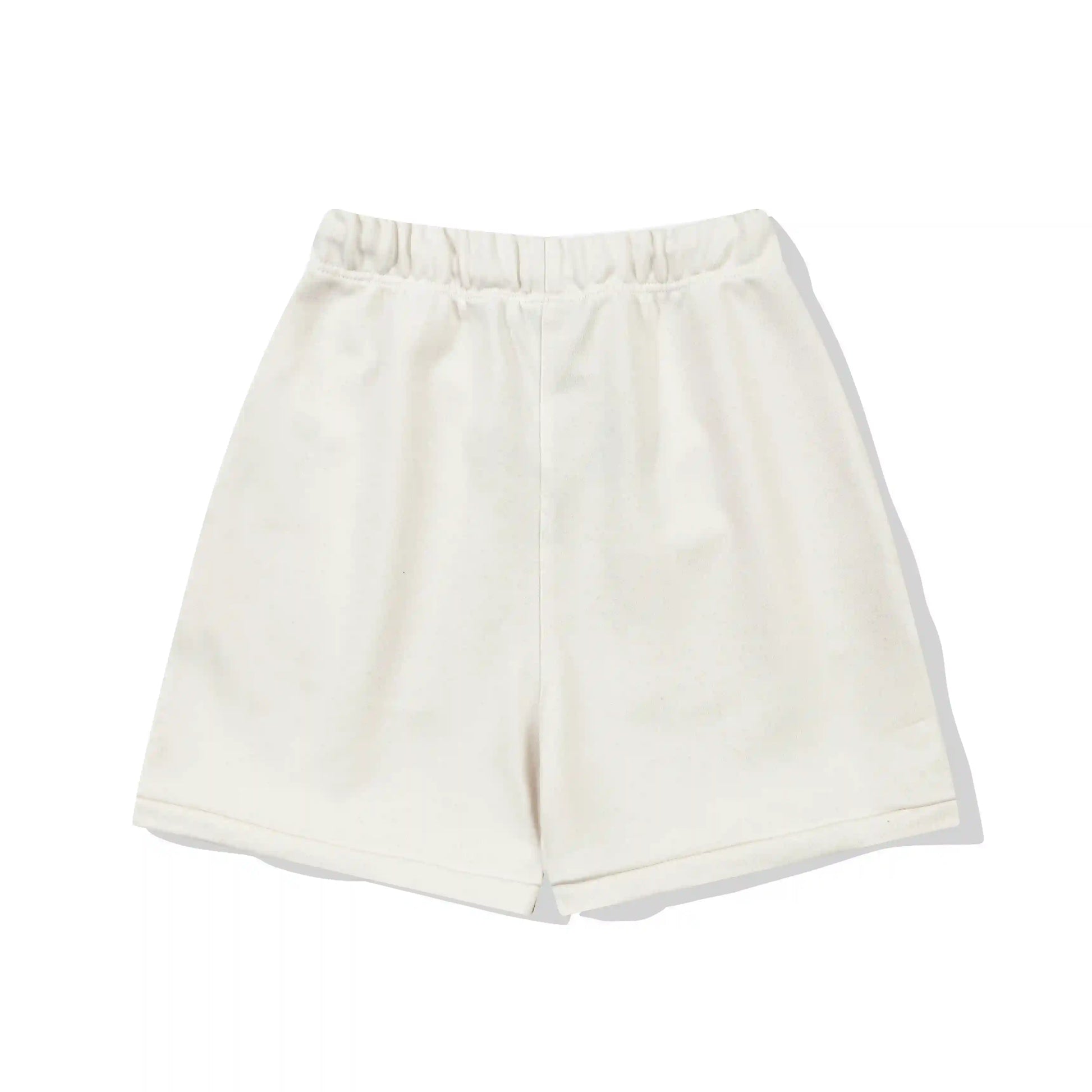 Fear of God Essentials Cloud Dance fleece shorts relaxed fit side view