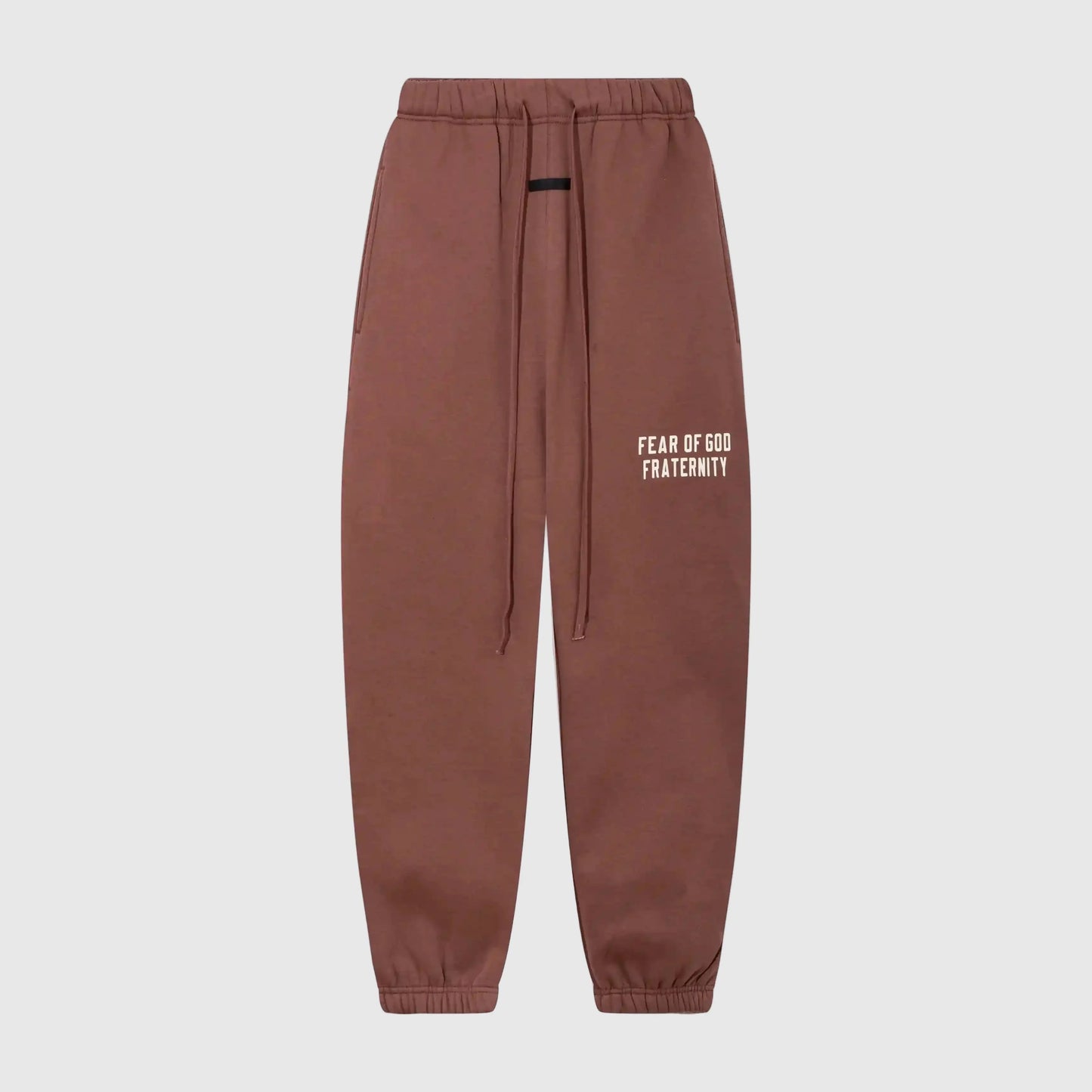 Essentials dark chestnut core fleece sweatpants by Fear of God front view