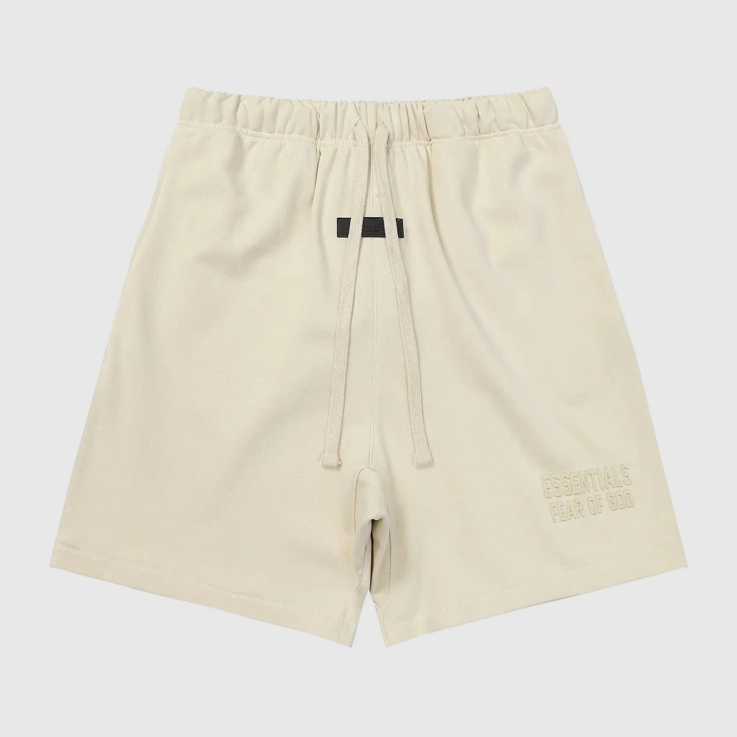 Fear of God Essentials white fleece shorts in cloud dance color with tonal branding and relaxed fit