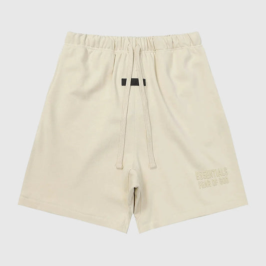 Fear of God Essentials white fleece shorts in cloud dance color with tonal branding and relaxed fit