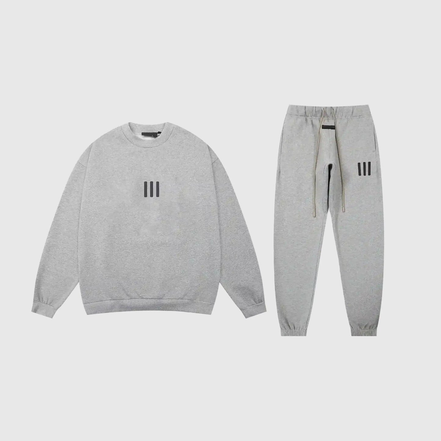 Fear of God Essentials dark heather oatmeal tracksuit front view crewneck and joggers