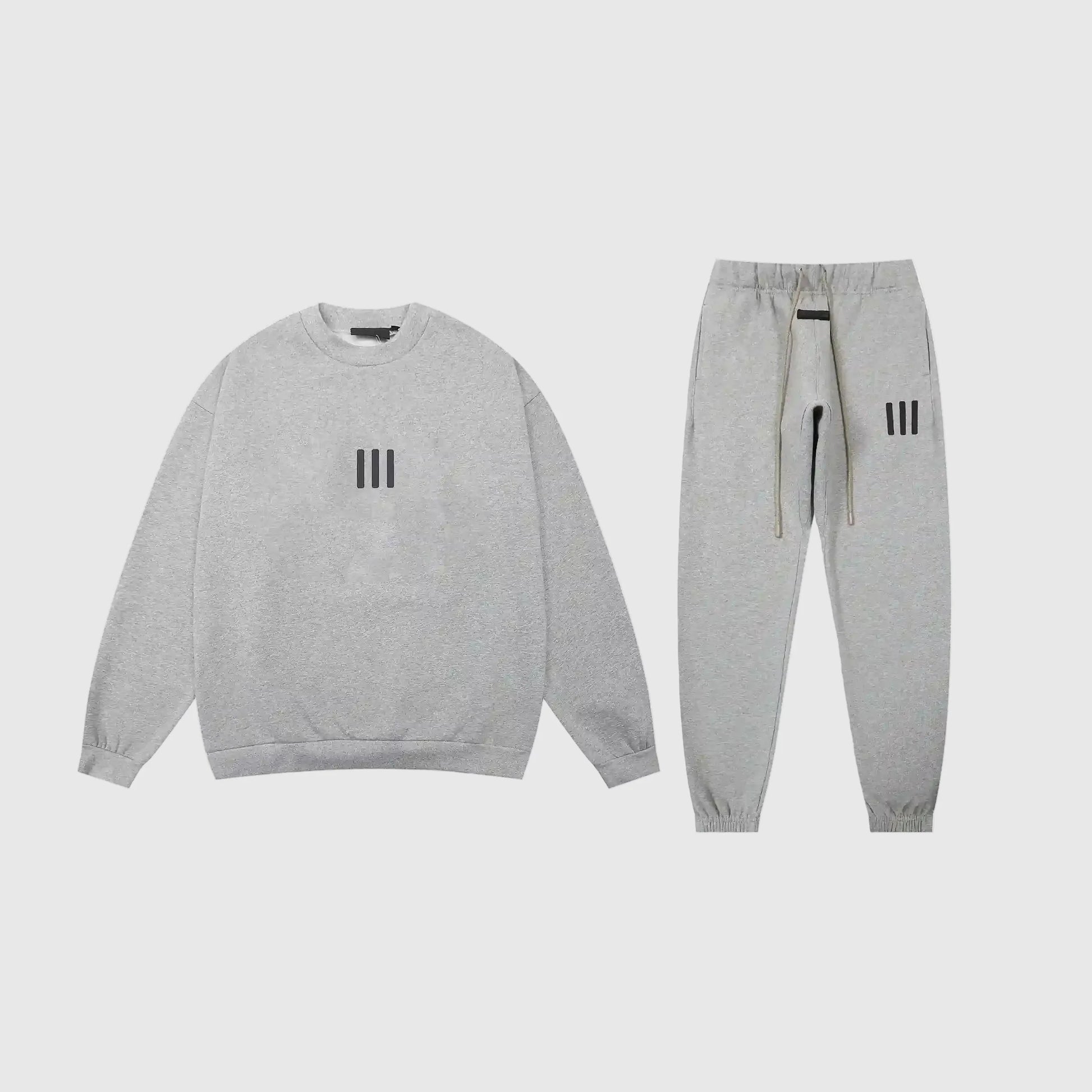 Fear of God Essentials dark heather oatmeal tracksuit front view crewneck and joggers