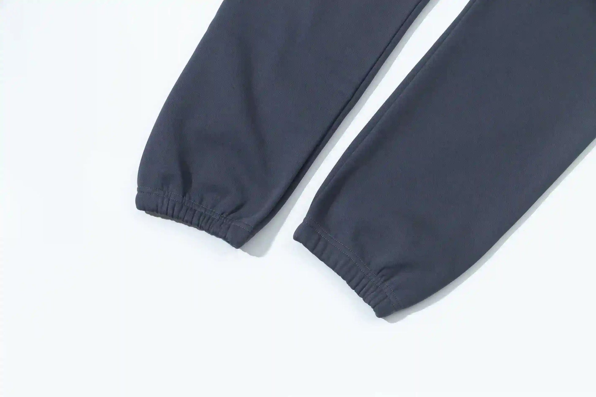 Jogger style blue sweatpants by Fear of God with elastic waistband