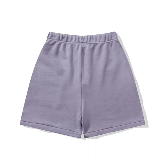 Fear of God Essentials pastel purple fleece shorts with tonal branding and relaxed fit