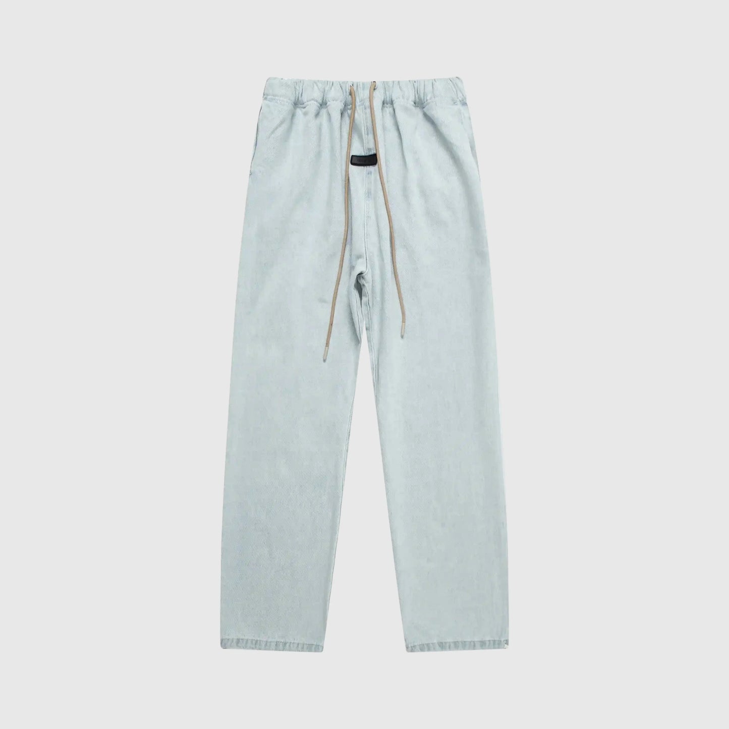 Essentials denim blue relaxed pants by Fear of God front view