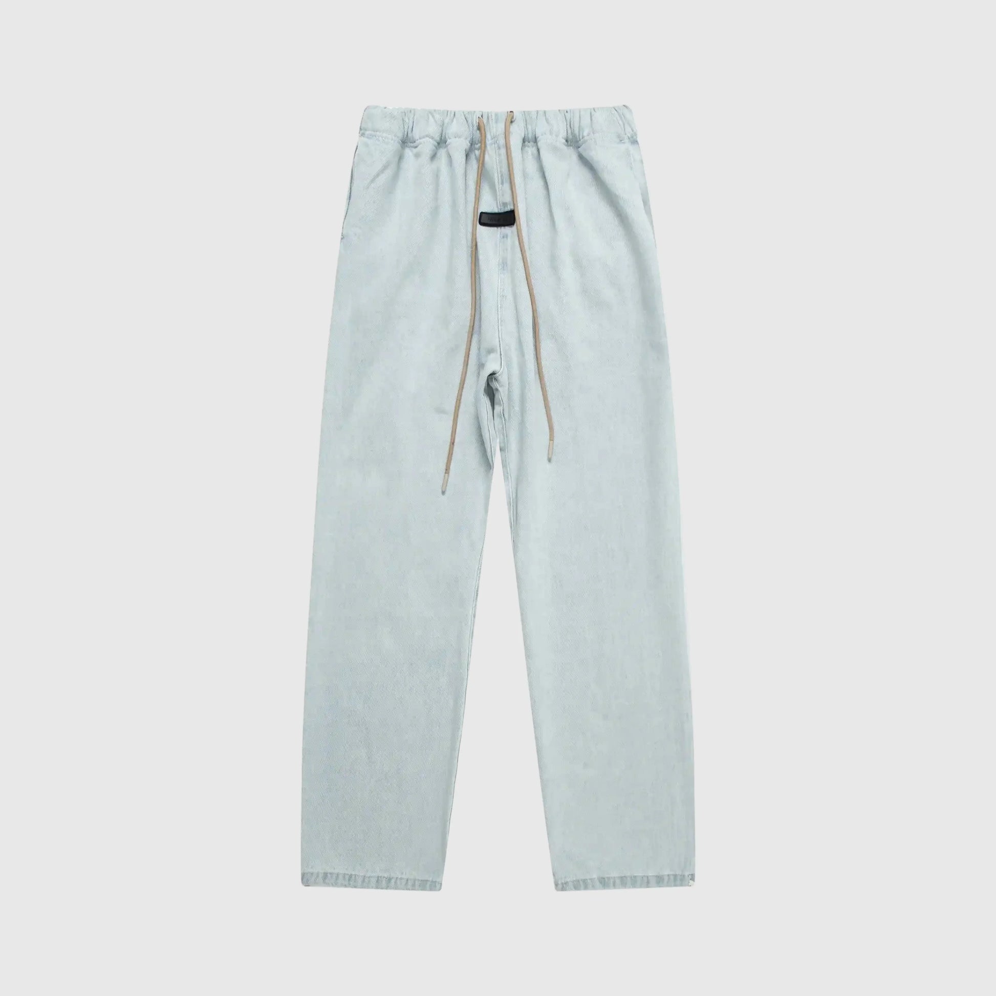 Essentials denim blue relaxed pants by Fear of God front view