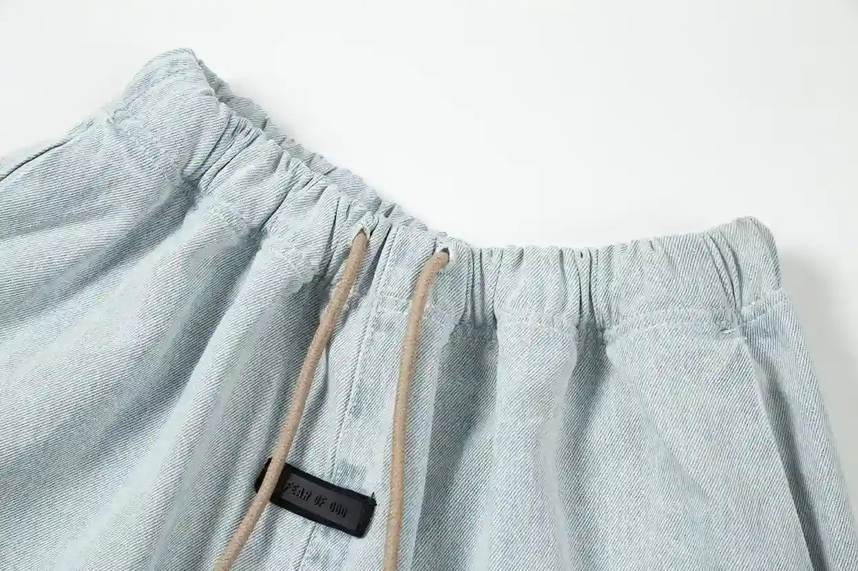 Premium fabric detail on denim blue pants by Fear of God