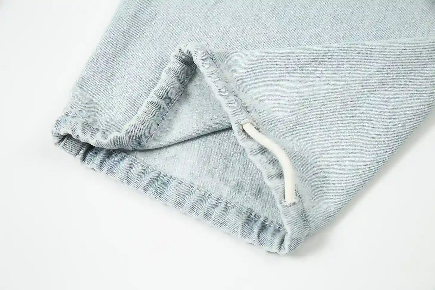 Relaxed silhouette denim blue pants by Fear of God with waistband detail