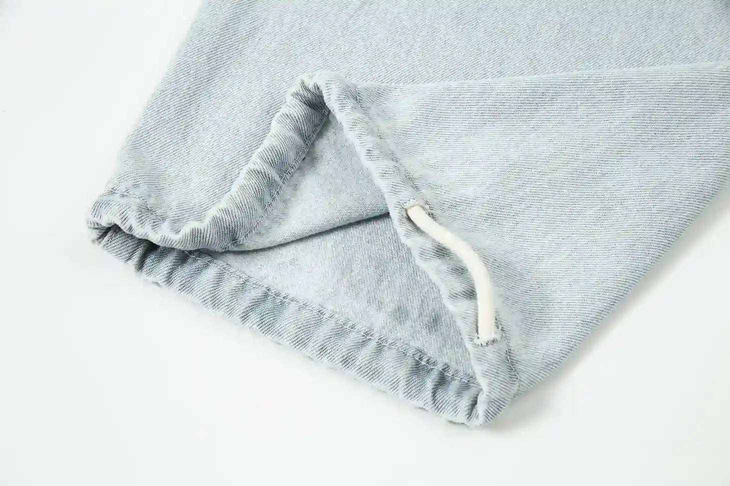 Relaxed silhouette denim blue pants by Fear of God with waistband detail